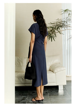 Rear view of navy linen midi dress with back slit for ease