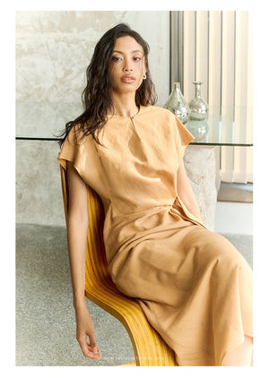 Side profile of linen dress showing waist definition and cap sleeves