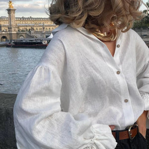 Natural linen blouse styled with belt and jeans