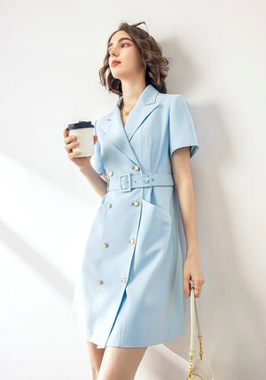 Model in light blue acetate blazer dress holding coffee