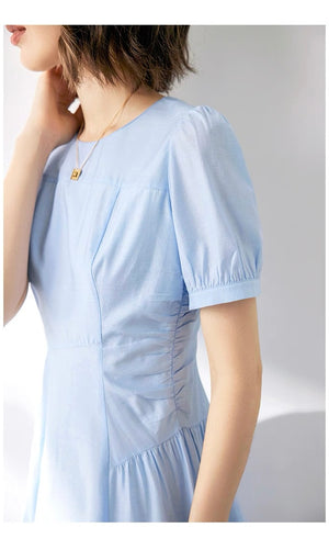 Close-up of puff sleeve detail and high waist seam