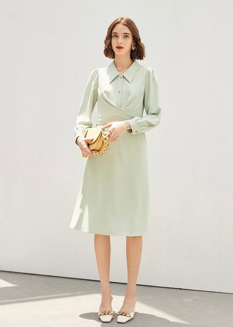 Closeup of collared lime green dress with 3/4 sleeves
