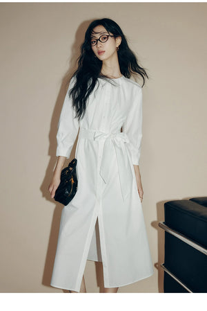 Front view of cream cotton shirt dress with brown buttons