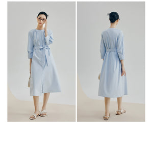 Back view showing gathered waistband and A-line skirt