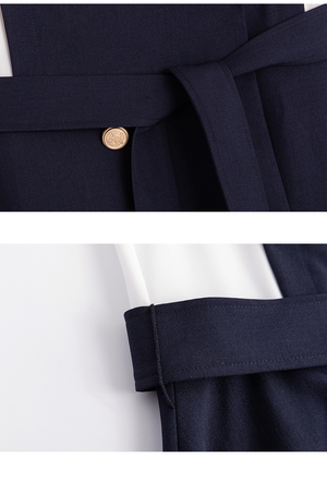 Double-breasted navy and white dress with feminine fit