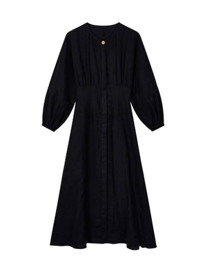 Front view of romantic round-neck dress with button detail