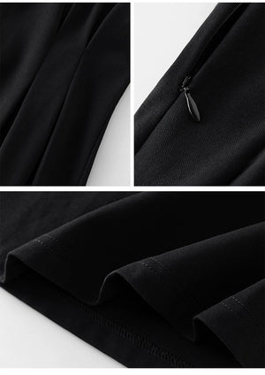 Back view of midi-length linen dress in black with puff sleeves