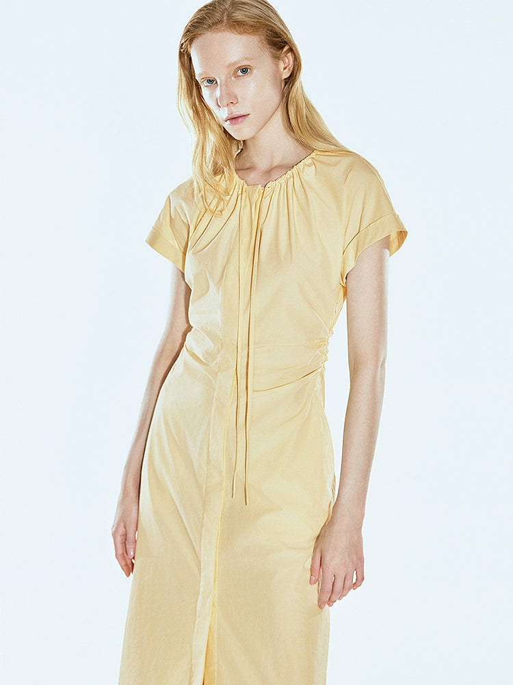 Autumn-ready pleated dress in soft yellow