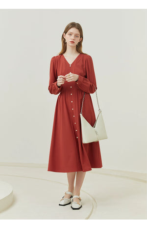 Close-up of linen fabric and hidden zip fastening on neutral-toned dress