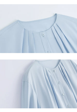 Close-up of chest pockets and collar on shirt dress