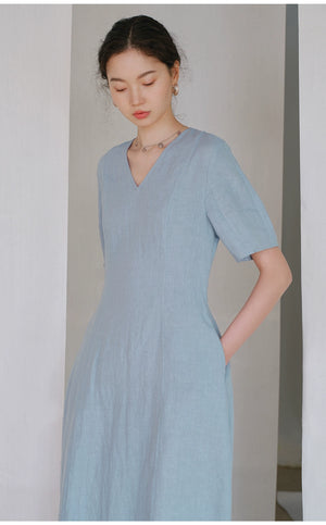 Linen V-neck midi dress with short sleeves on wooden hanger