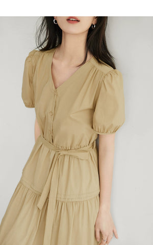 Romantic tiered A-line dress with cinched waist and puff sleeves