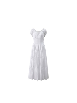Elegant white dress with tiered skirt and puff sleeves