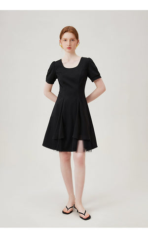 Scoop neckline and structured seams of dress
