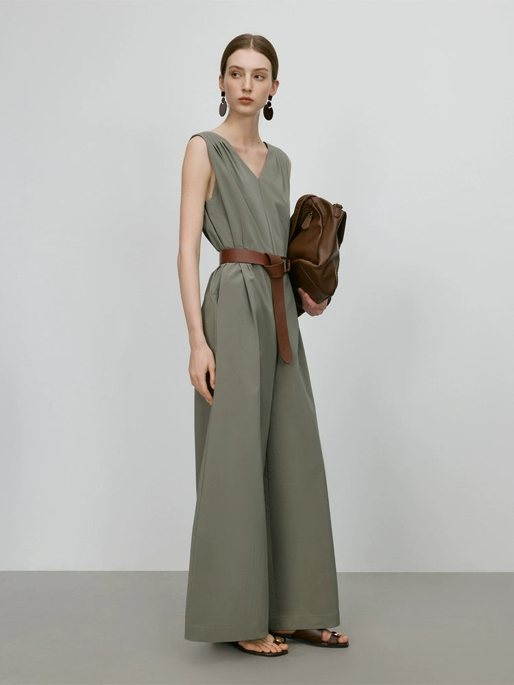 Sleeveless green vest-style jumpsuit with wide-leg fit