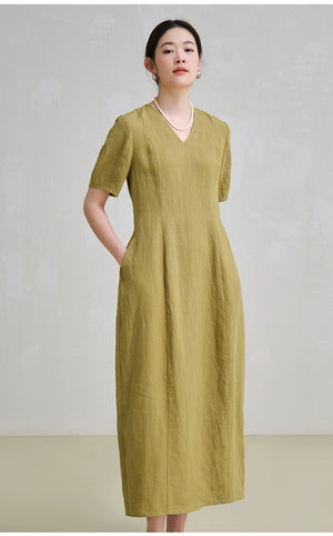 Model in linen midi dress with tailored fit and short sleeves