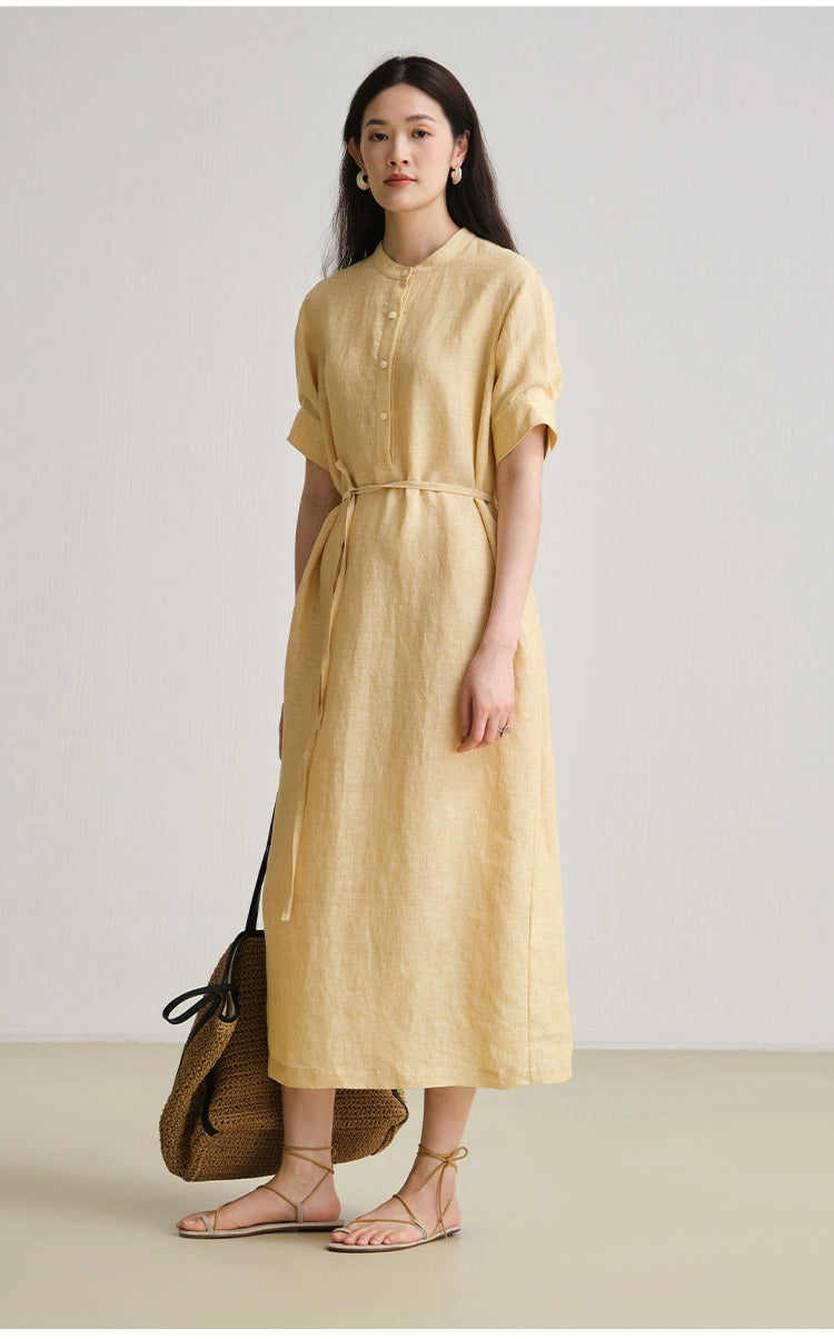 Close-up of shirt collar and button placket detail on linen dress