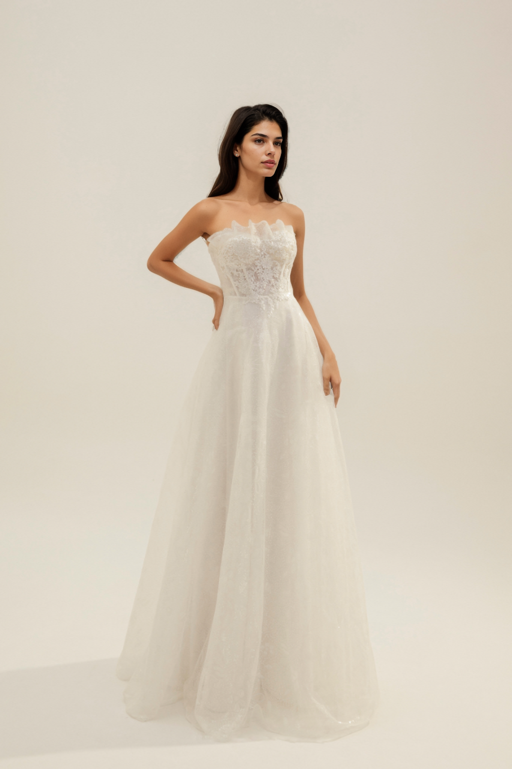 Sweetheart neckline wedding dress with pleated layers and floral embellishments
