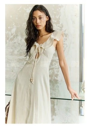 Side view of tie-front linen midi dress showing keyhole neckline