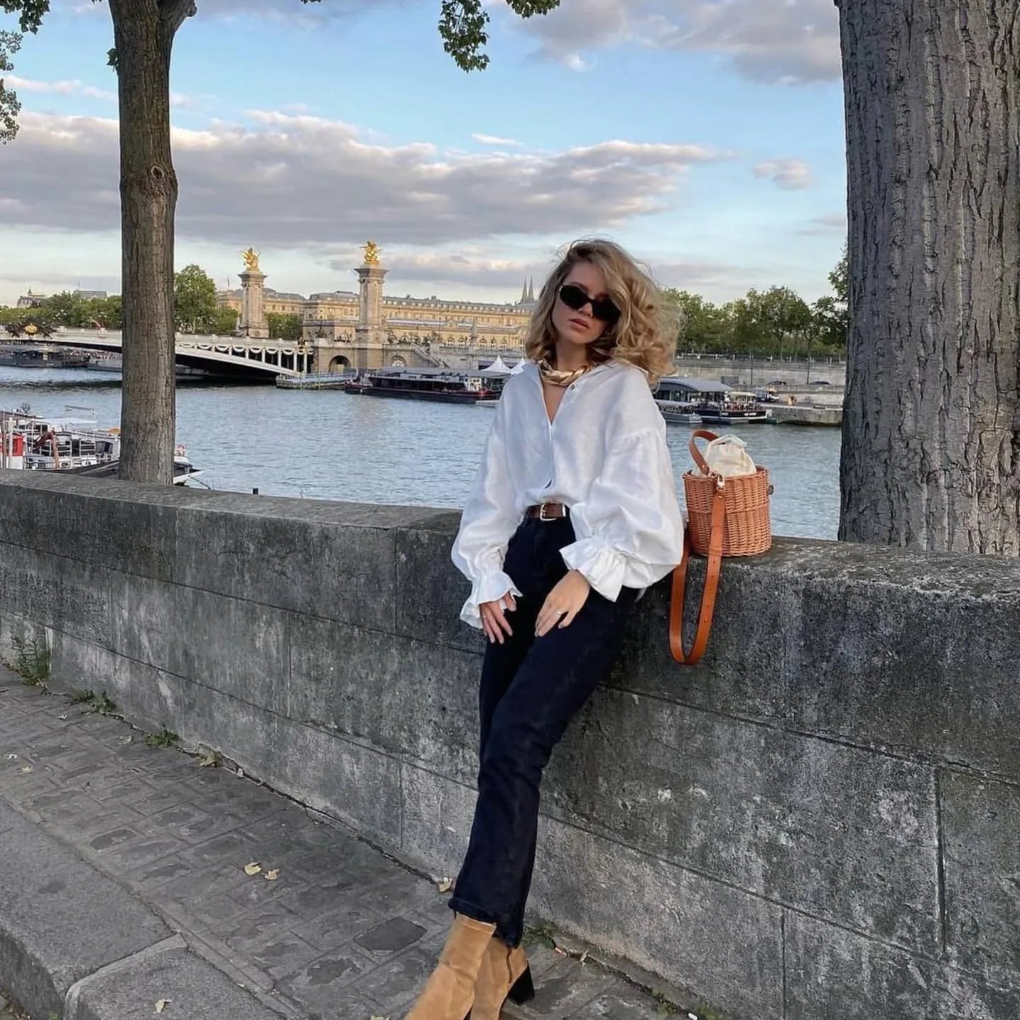 Natural linen blouse styled with belt and jeans