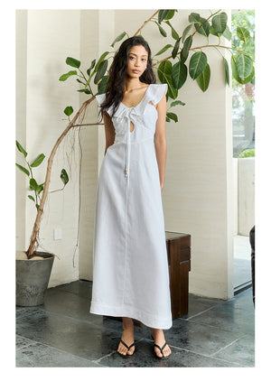 Model holding scarf tote styling flutter sleeve dress