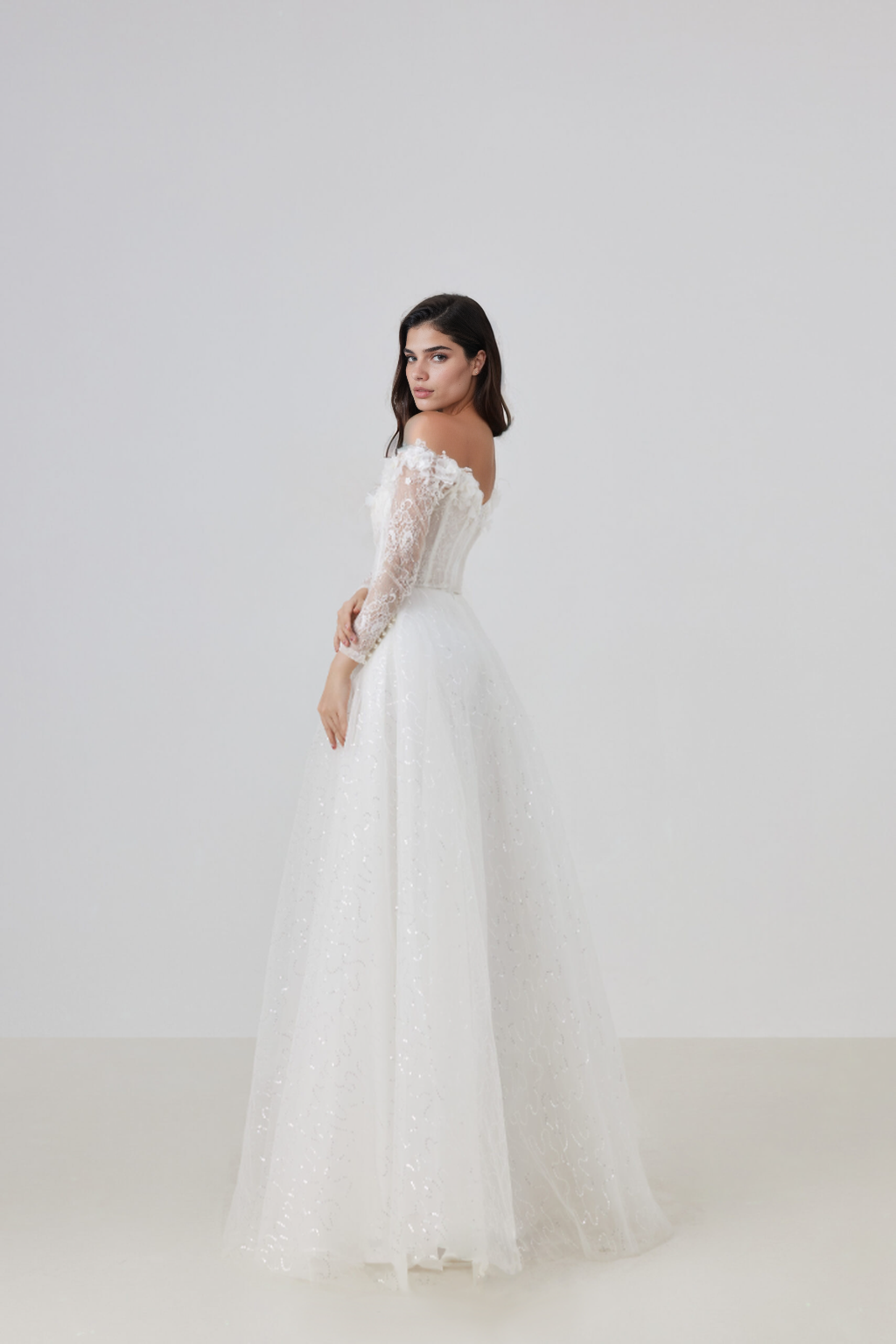Strapless lace dress with a flared skirt adorned with 3D flowers