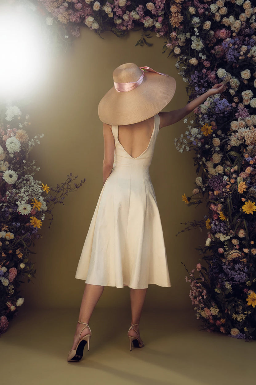 Feminine summer linen midi dress styled outdoors