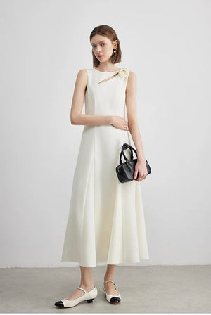 Front view of ivory sleeveless midi dress with flower accent