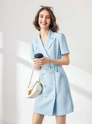 Close-up of structured lapel and belt on blazer dress