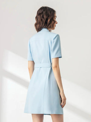 Double-breasted dress with gold buttons and waist cinch