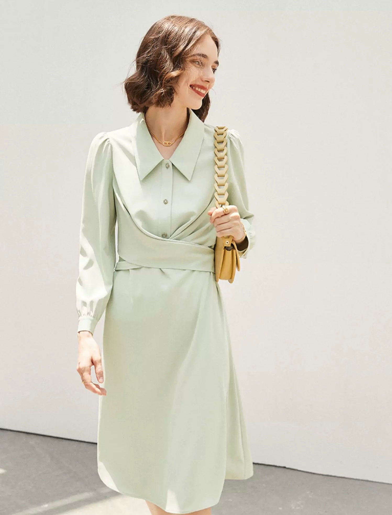 Woman in lime green vintage puff sleeve dress