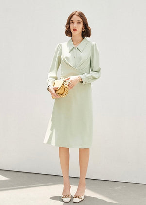 Closeup of collared lime green dress with 3/4 sleeves