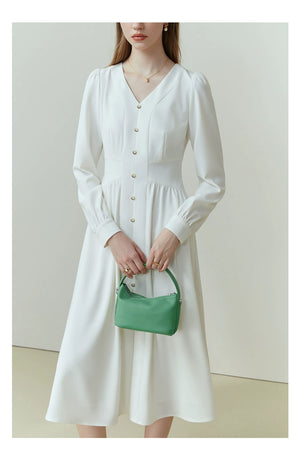 Rear view of navy linen midi with back slit and tailored shape