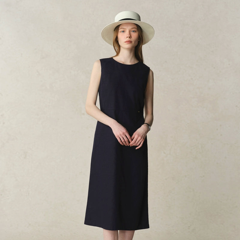 Minimalist white dress styled for warm days