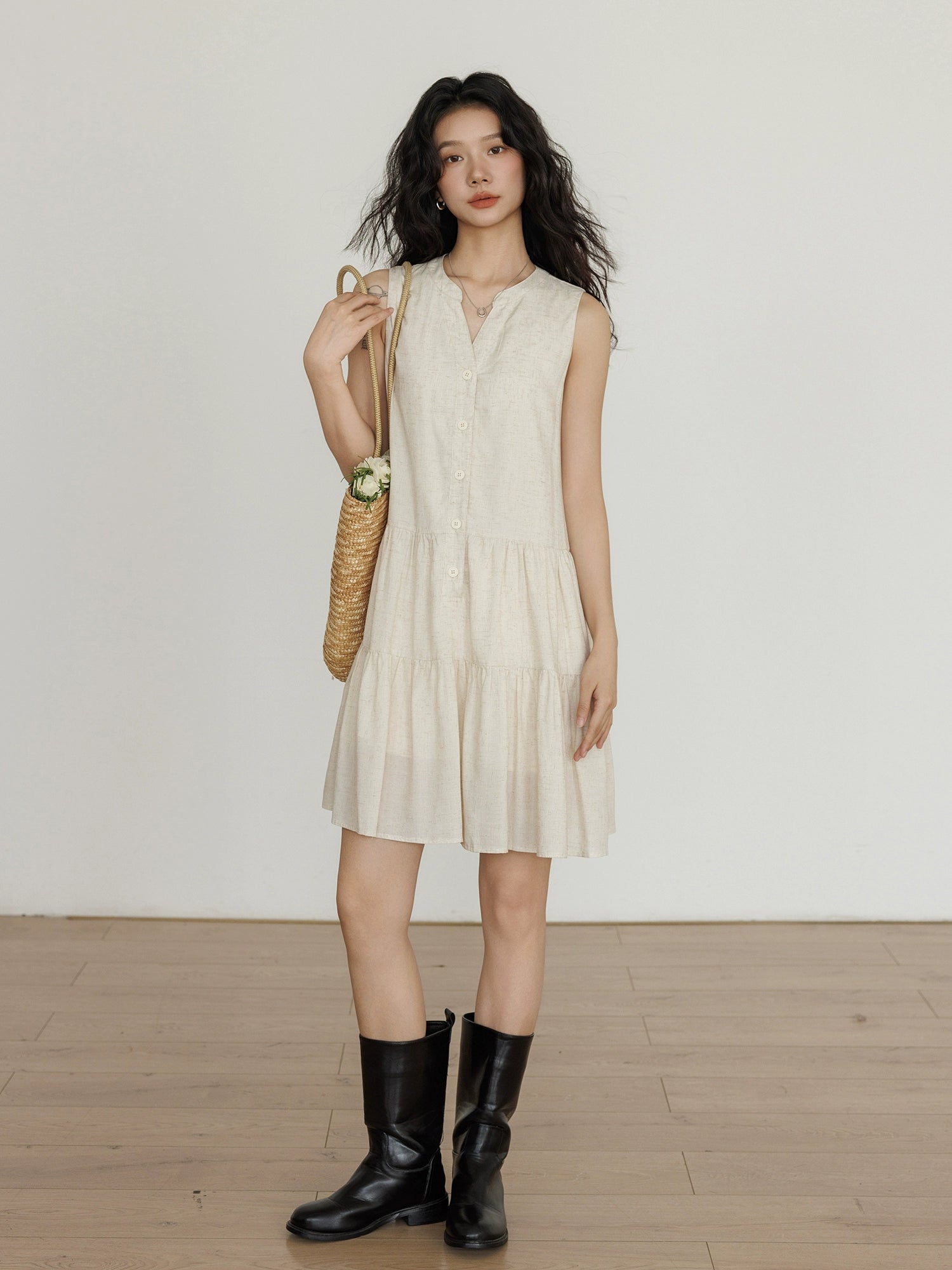 Taileroom short vest-style dress with subtle buttonsLightweight sleeveless linen dress with basket bag