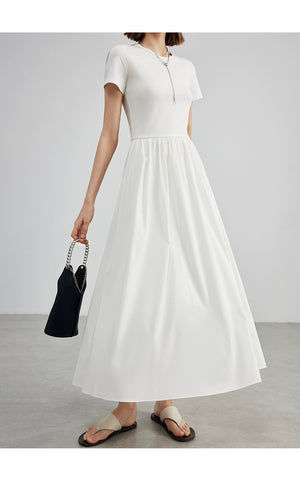 Elegant cream cotton dress styled with minimalist accessories