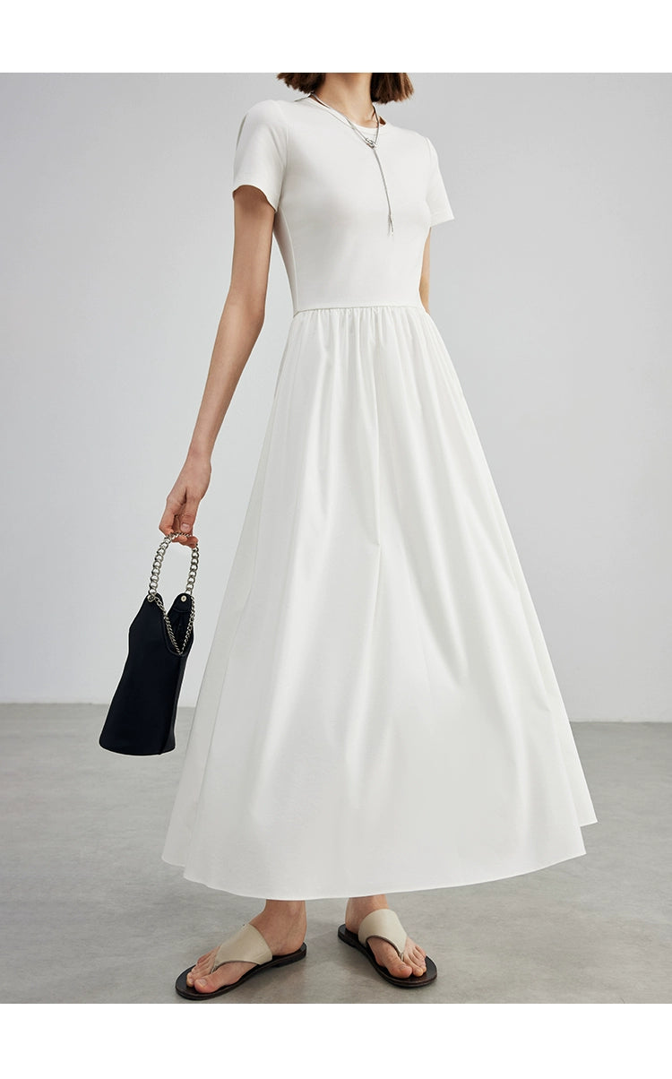 Elegant cream cotton dress styled with minimalist accessories