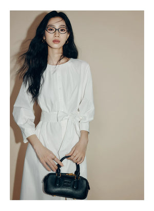 Back view showing gathered waistband and A-line skirt