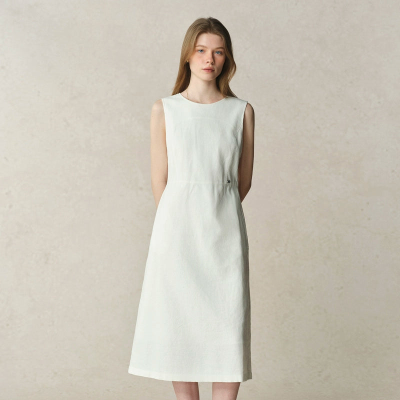 Minimalist white dress styled for warm days