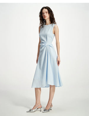 Cinched waist midi dress styled with silver heels