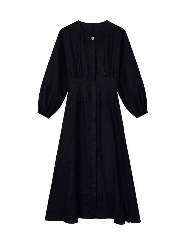 Front view of romantic round-neck dress with button detail