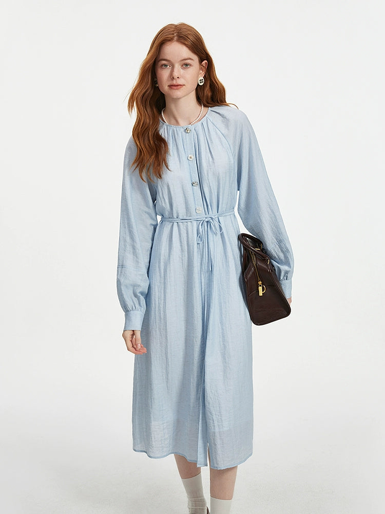 Elegant blue cotton dress styled with leather accessories
