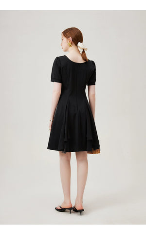 Tulle layer close-up on flared black dress