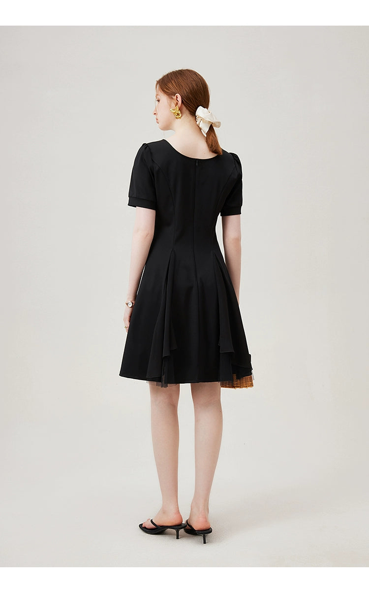 Tulle layer close-up on flared black dress