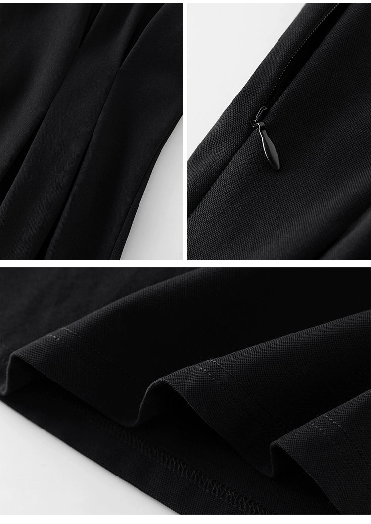 Back view of midi-length linen dress in black with puff sleeves