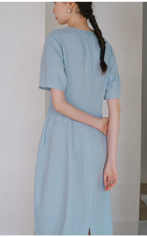 Back slit and hidden zipper detail on linen midi dress
