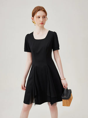 Puff sleeve hem detail on black cotton dress