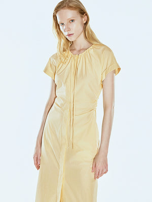 Autumn-ready pleated dress in soft yellow