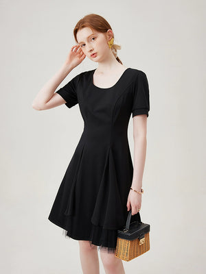 Tulle layer close-up on flared black dress