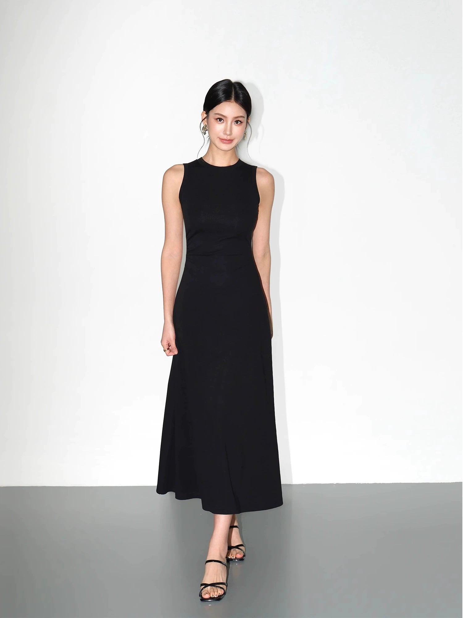 Minimalist black dress with sculpting waistline
